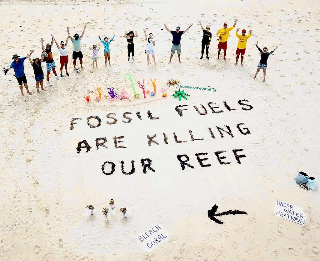 Greenpeace Australia volunteers and Surf Lifesavers at Fingal Bay, NSW, bring attention to the campaign to protect the Great Barrier Reef.
They create a sign on the beach that reads 'Fossil Fuels are Killing our Reef'.