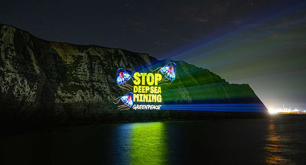 "Stop Deep Sea Mining" is projected on the White Cliffs of Dover calling for a halt to deep sea mining. The ISA has opened up over 1.5 million km2 – an area four times the size of Germany - for deep sea mining exploration.
