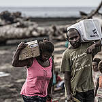 Locals from Port Narvin Village, Erromango receiving food supplies from Greenpeace. Extreme weather events, such as Cyclone Pam, threaten to become the new normal for Pacific island states as the global climate changes, underscoring the urgency to cut global emissions to avert a climate crisis.