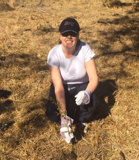 Simone Cooper plants a tree
