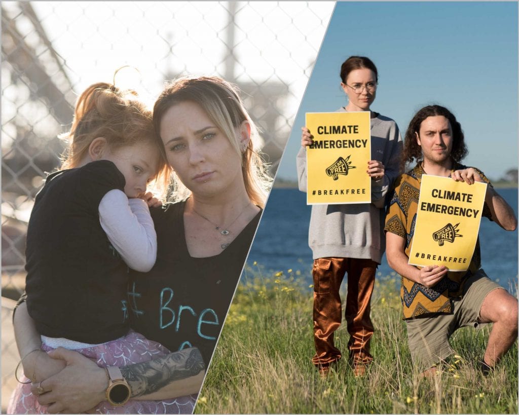 Woman holding baby and young women and man holding placards