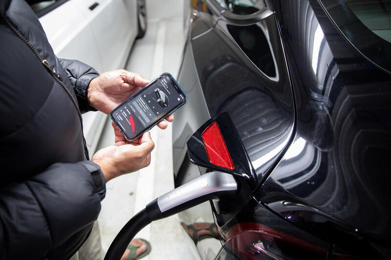 Electric Vehicle Owner James Using App in Australia