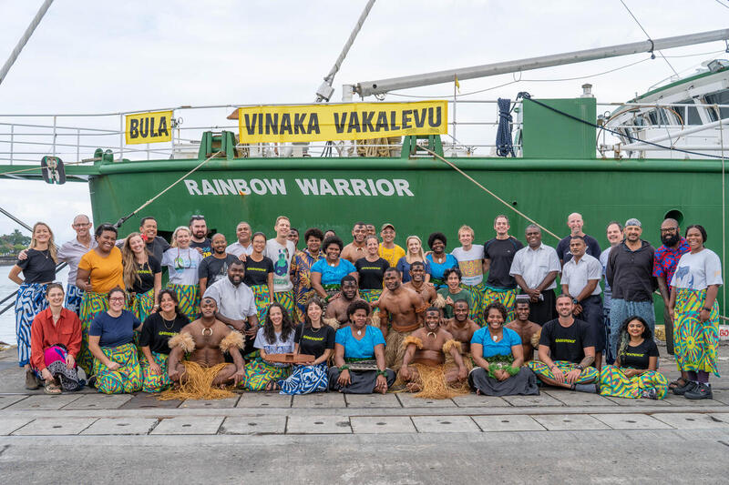 Greenpeace crew and the Dulali Traditional Meke Group in front of the Rainbow Warrior|A Traditional Kava Ceremony (Yaqona Vakaturaga) to welcome Greenpeace to Fiji