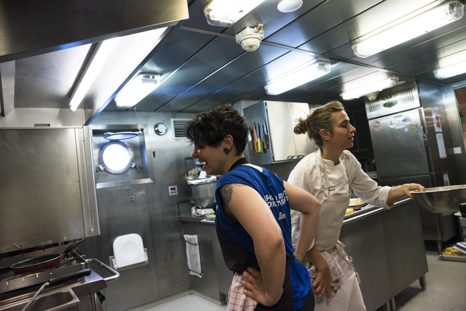 Laurence and Daniela Carvau, volunteer cook’s assistant, in the galley