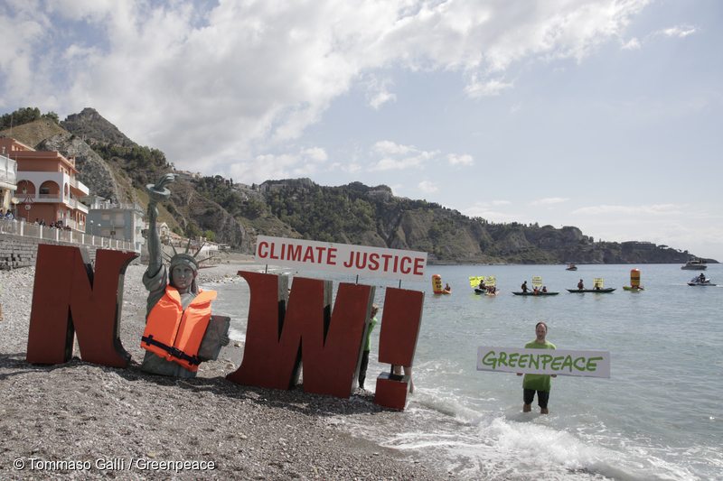 At the Giardini Naxos beach in Taormina, Greenpeace activists unveil a four-meter-high Statue of Liberty replica covered with a life jacket to symbolise the threat that climate change and rising seas pose. In the water, activists in kayaks unfurl flags and banners with the message 'Planet Earth first'. Greenpeace is calling on the G7 leaders to rapidly implement the Paris Climate Agreement, a generation-defining pact signed by nearly 200 countries, and to resolutely move forward despite the threats of US President Trump to abandon the agreement.