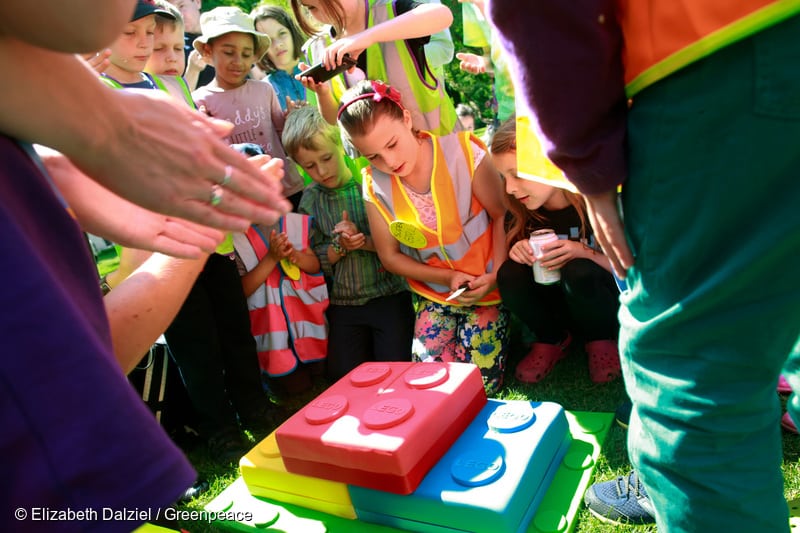 'Save the Arctic' Kids LEGO Protest at Shell HQ in London. Children are having a picnic with a giant Lego cake after their protest outside the Shell HQ. 07/29/2014 © Elizabeth Dalziel / Greenpeace