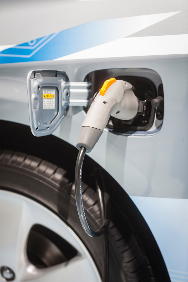 E-car with charging cable during International Automobile Fair (IAA).