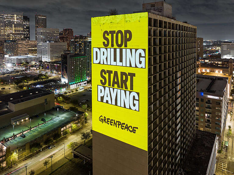 "Make Polluters Pay" Projection in Houston. &copy; Greenpeace