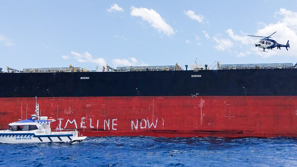 Police arrive at coal ship Yangze 16 where Greenpeace activists were suspended in a 7-hour protest against coal and gas