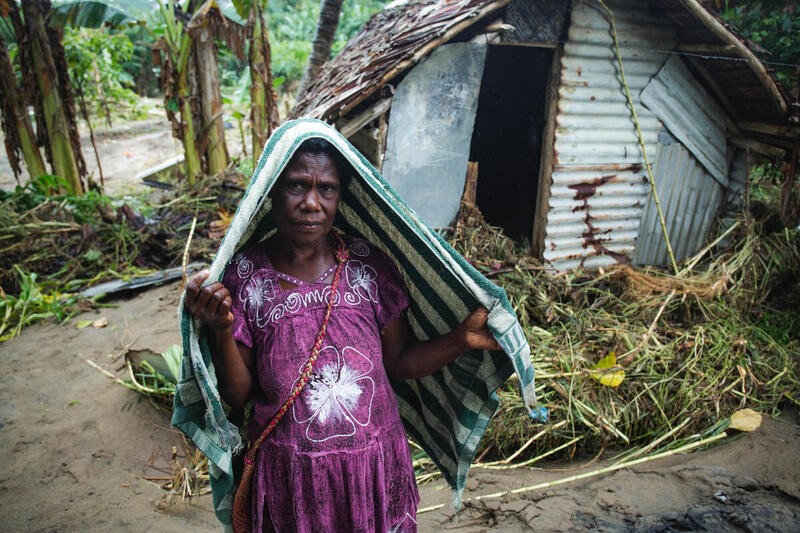 Villager and Severely Damaged Home in Vanuatu